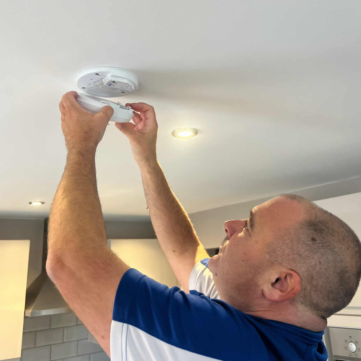 Smoke alarm being installed on a ceiling in Benfleet